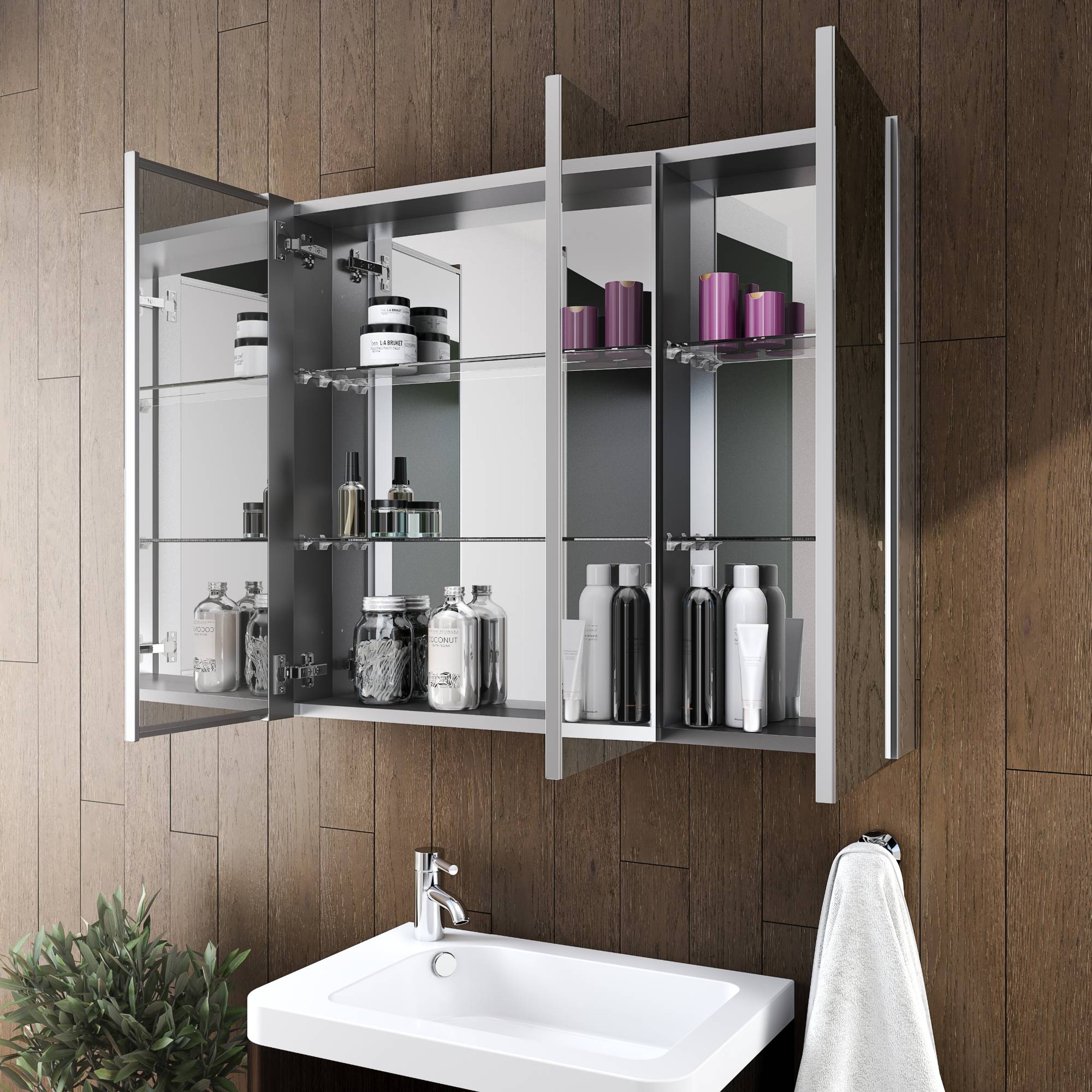Fleurco triple-door medicine cabinet shown open with glass shelves