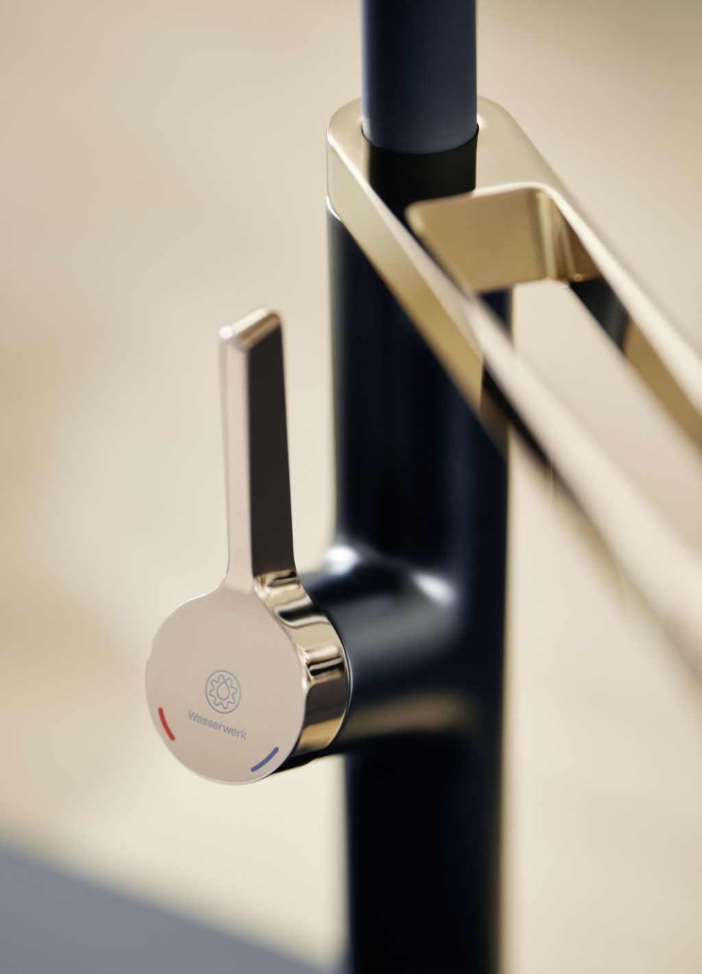 Close-up of a Wasserwerk faucet handle with black and gold finish